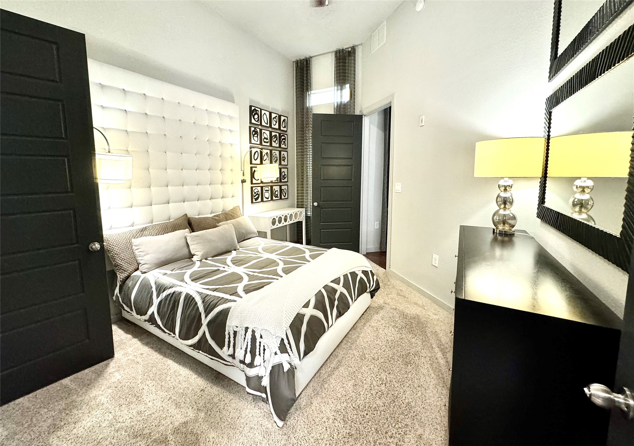 2525 McCue Road, Unit 249 Houston, TX 77056 - Photo 6 of 13 a bedroom with a bed and a night stand
