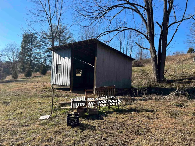 a view of a yard covered with snow in the yard