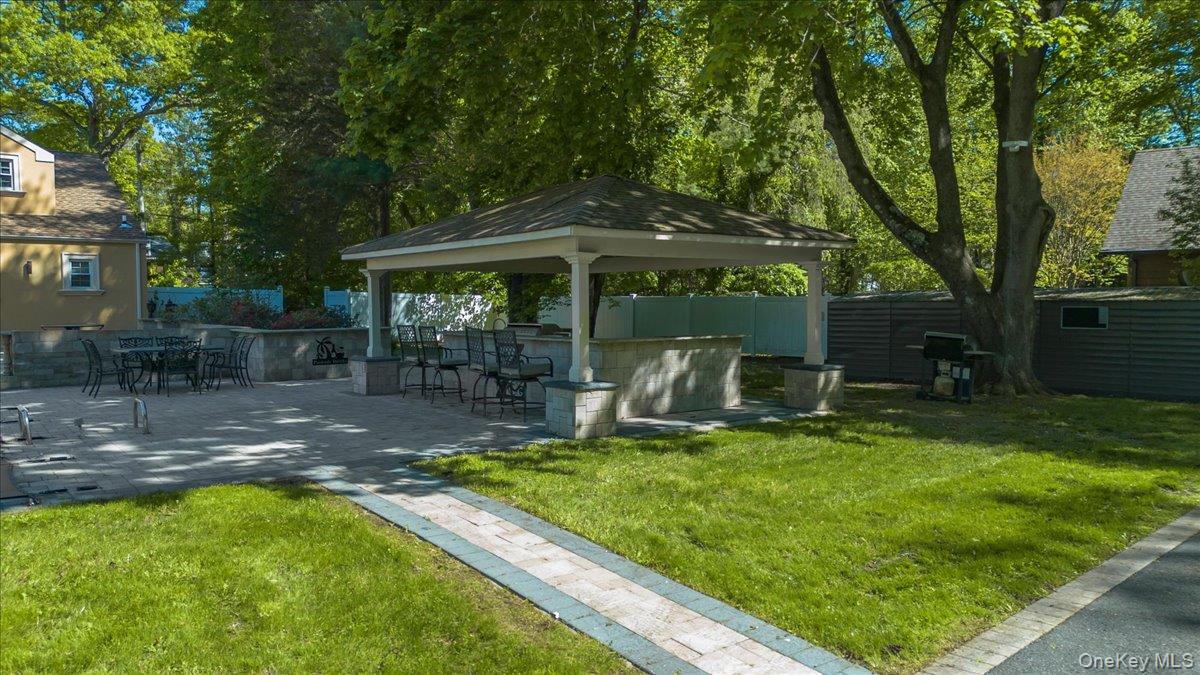 626 Caledonia Road Dix Hills, NY 11746 - Photo 42 of 49 a view of a backyard with sitting area
