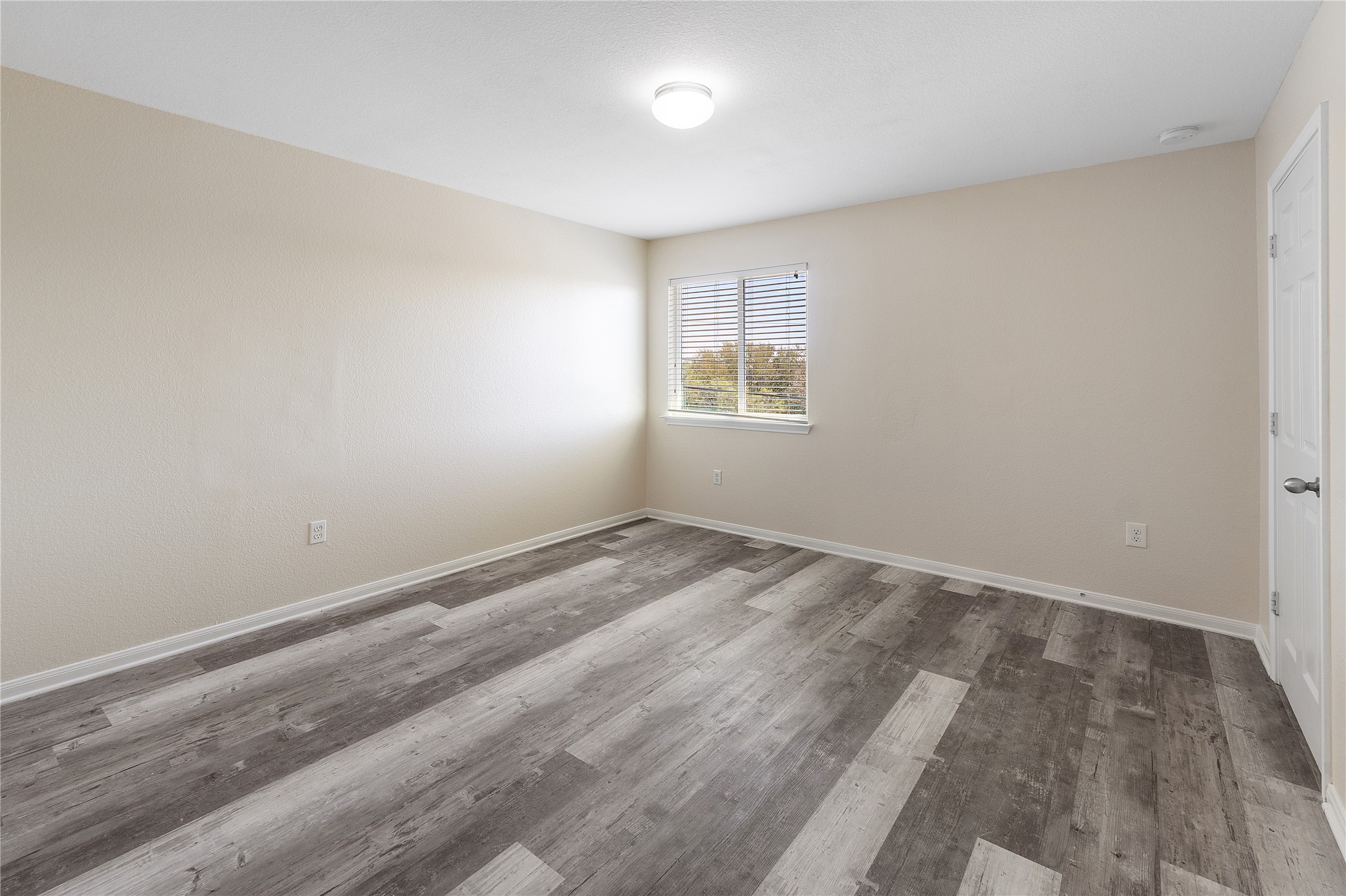 18436 Weatherby Lane Elgin, TX 78621 - Photo 15 of 23 Spare room with wood finished floors and baseboards