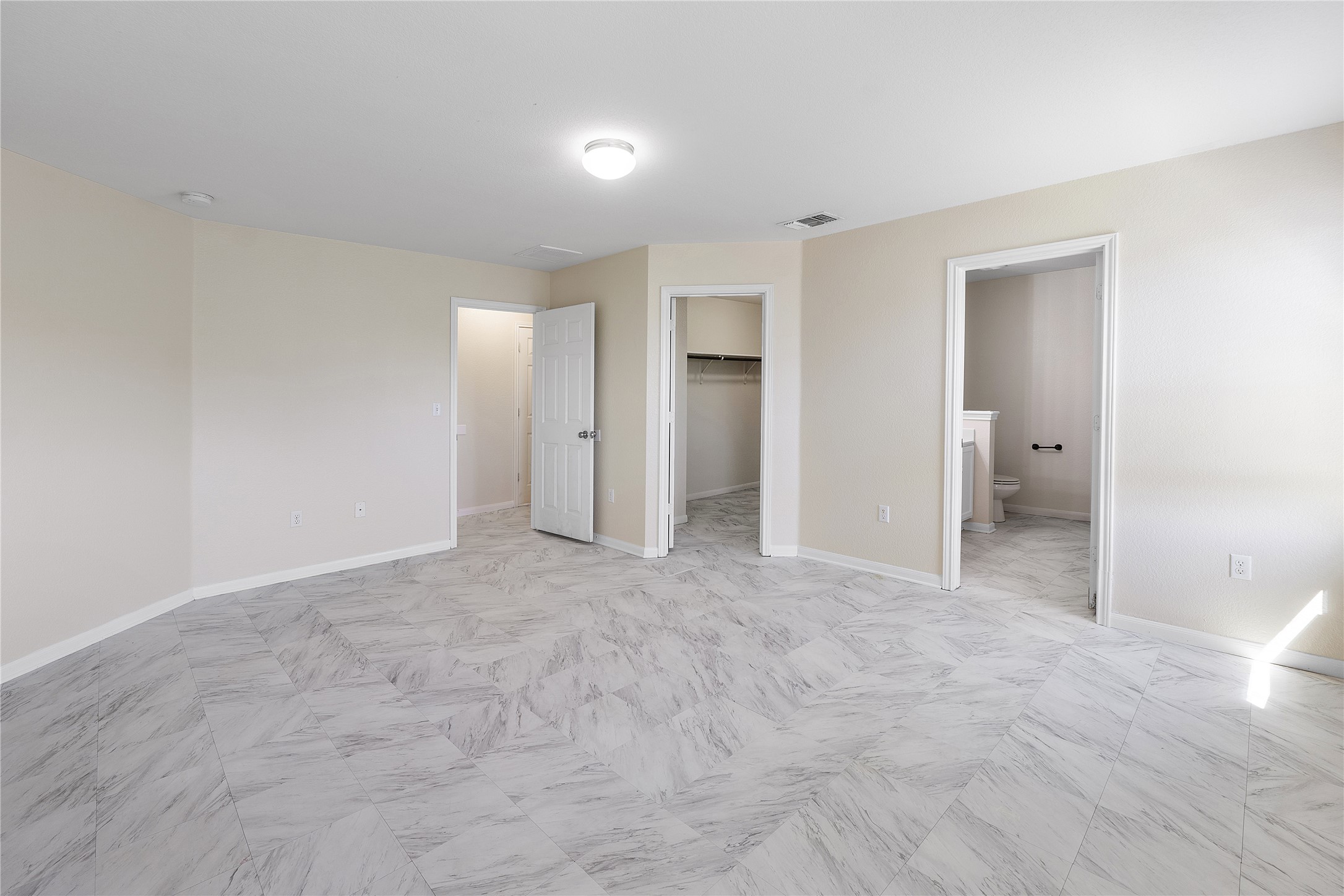 18436 Weatherby Lane Elgin, TX 78621 - Photo 9 of 23 Unfurnished bedroom featuring a spacious closet and ensuite bath