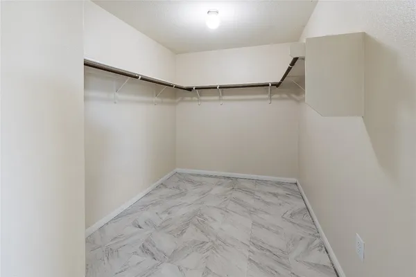 a view of an empty walk in closet