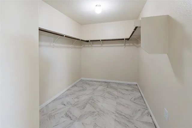 a view of an empty walk in closet