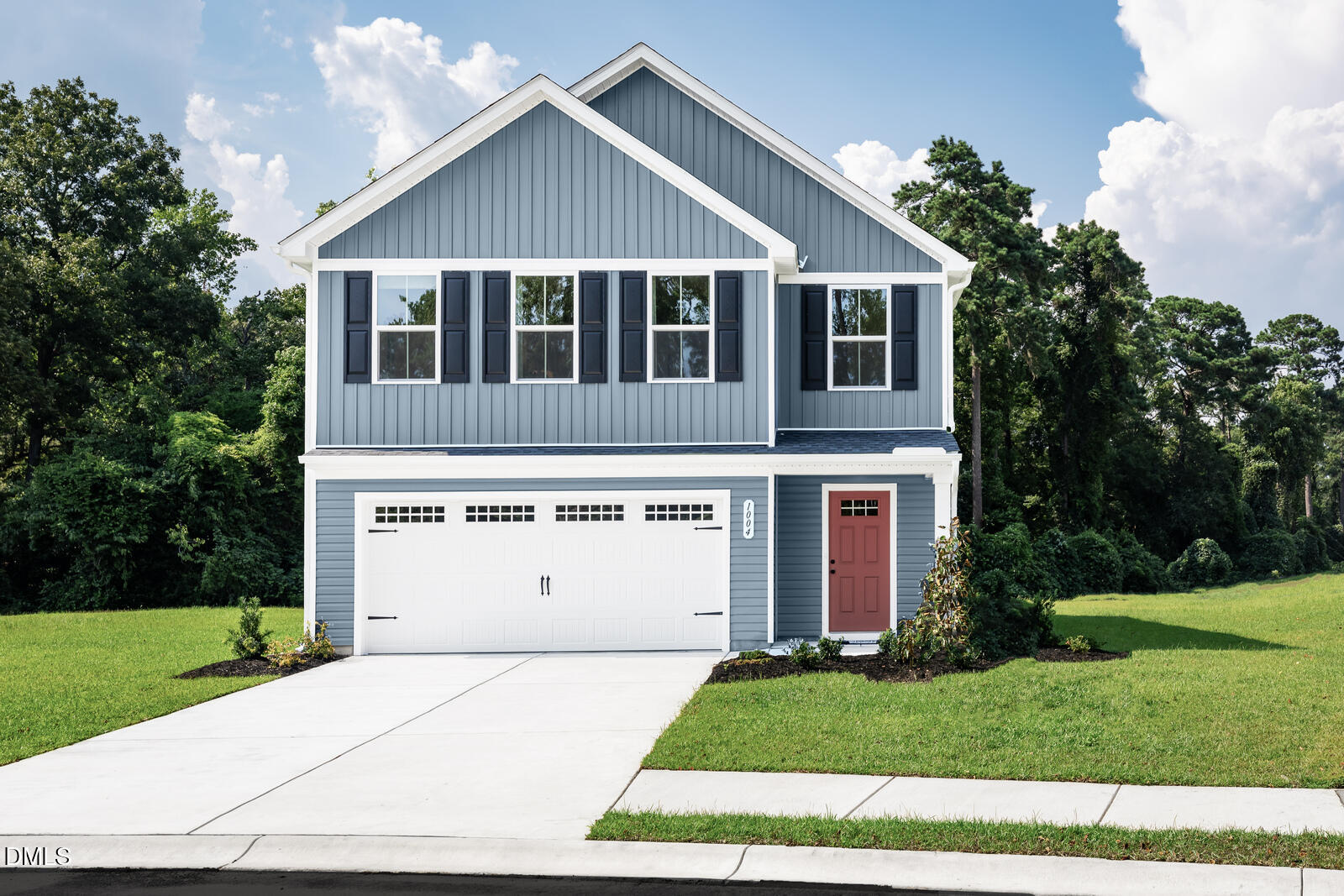 a view of a house with a yard and garage