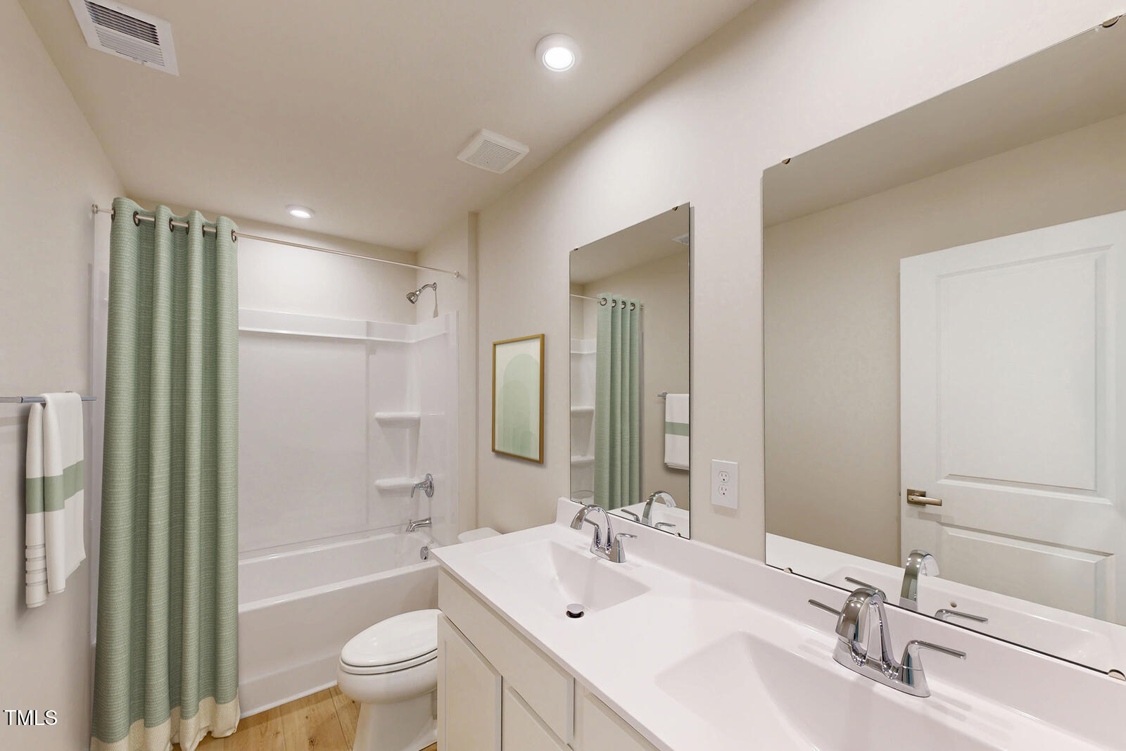 108 Cavalier Rider Run Wendell, NC 27591 - Photo 11 of 21 a bathroom with a bathtub shower sink mirror vanity and a toilet