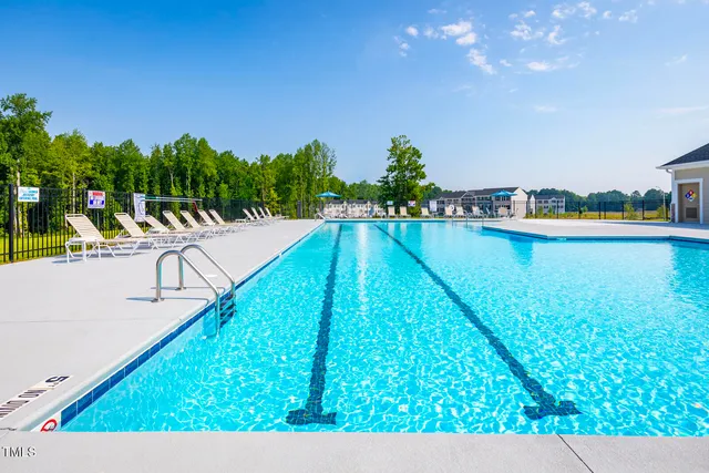 a view of swimming pool with a outdoor seating