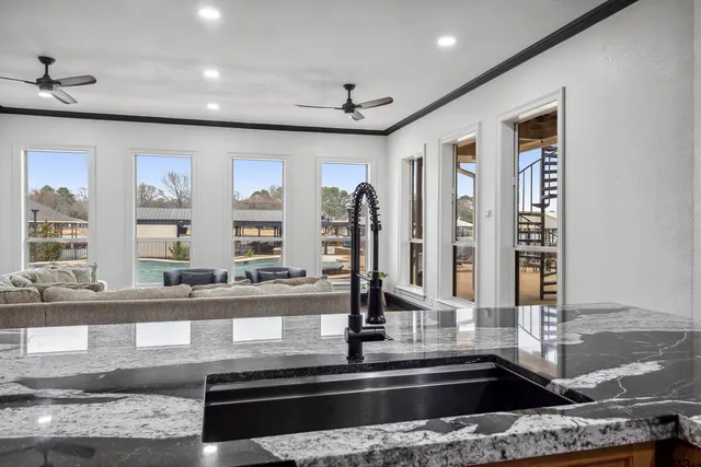 a kitchen with granite countertop a sink and a window