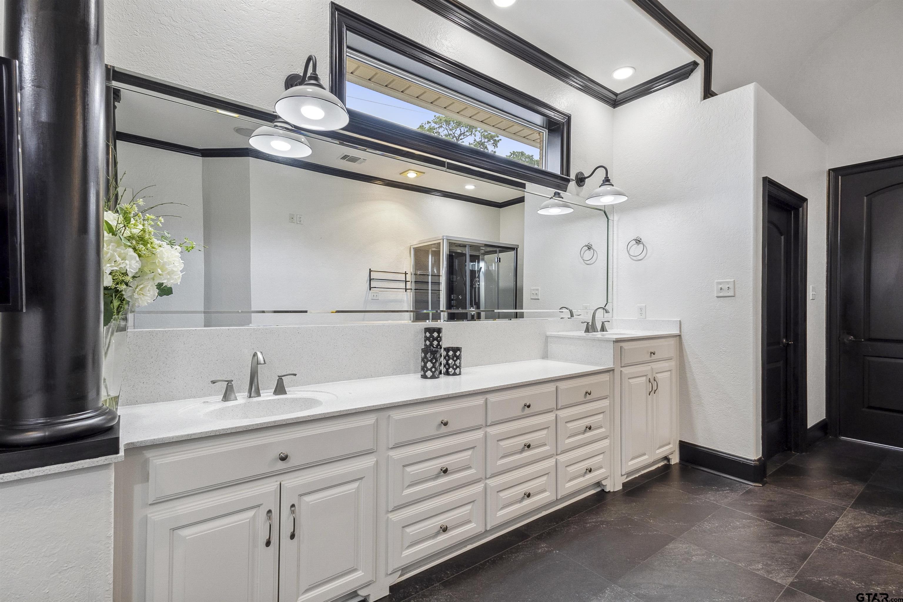 17729 Southpoint Road Whitehouse, TX 75791 - Photo 24 of 48 a bathroom with a double vanity sink and a mirror