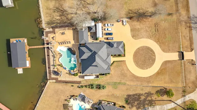 a bathroom with a sink mirror and vanity