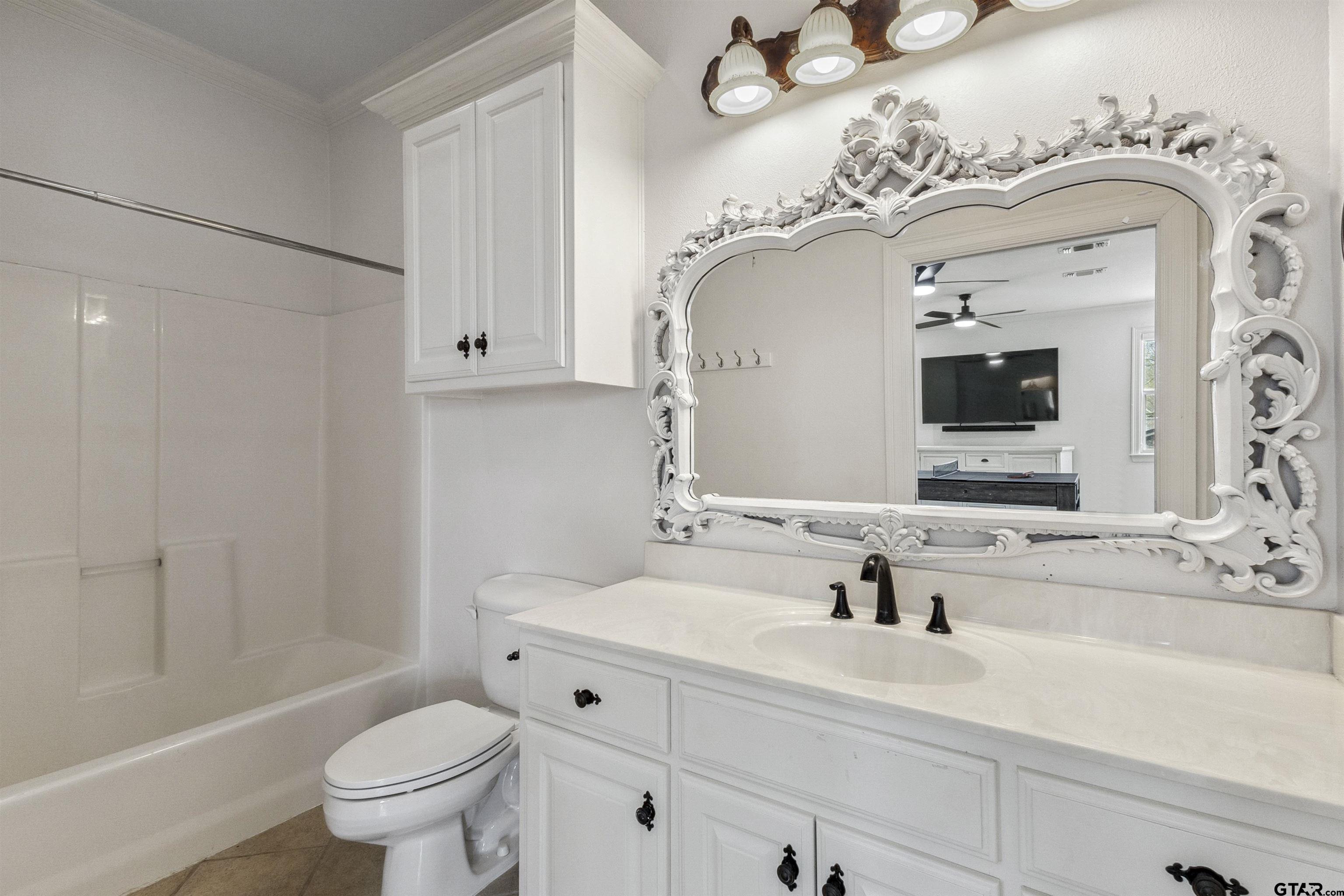 17729 Southpoint Road Whitehouse, TX 75791 - Photo 34 of 48 a bathroom with a sink and a mirror