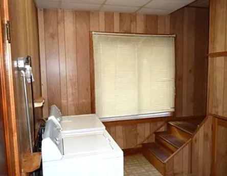 a bathroom with a tub and shower