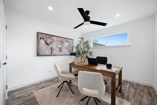 a dining room with furniture and window
