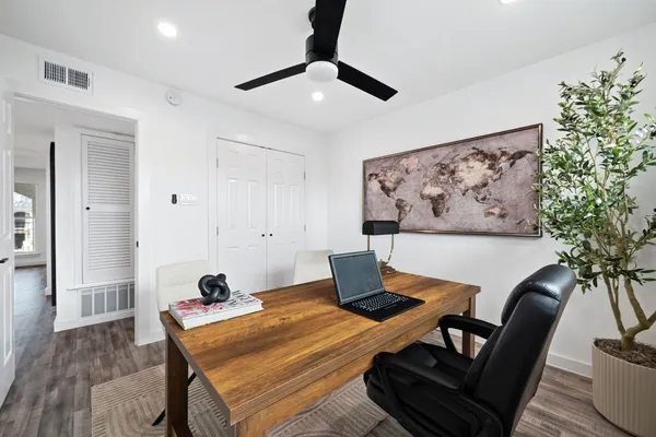 a workspace with furniture and wooden floor
