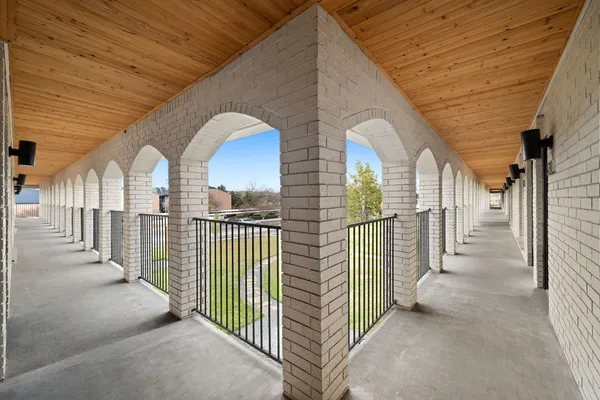 a view of a house with wooden fence