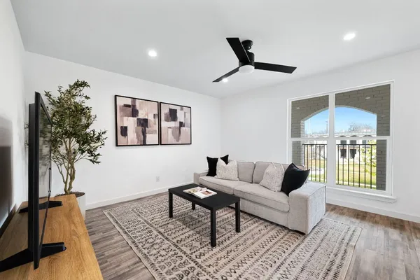 a living room with furniture and a window