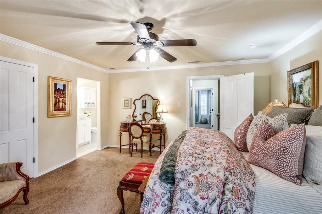 1349 Roaring Springs Road Fort Worth, TX 76114 - Photo 16 of 30 Bedroom featuring ceiling fan, light colored carpet, ornamental molding, and ensuite bath