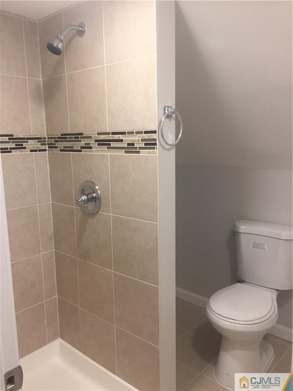 38 Sine Road Edison, NJ 08817 - Photo 12 of 15 a bathroom with a toilet and a shower