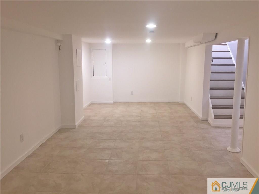 38 Sine Road Edison, NJ 08817 - Photo 15 of 15 wooden floor in an empty room with a window