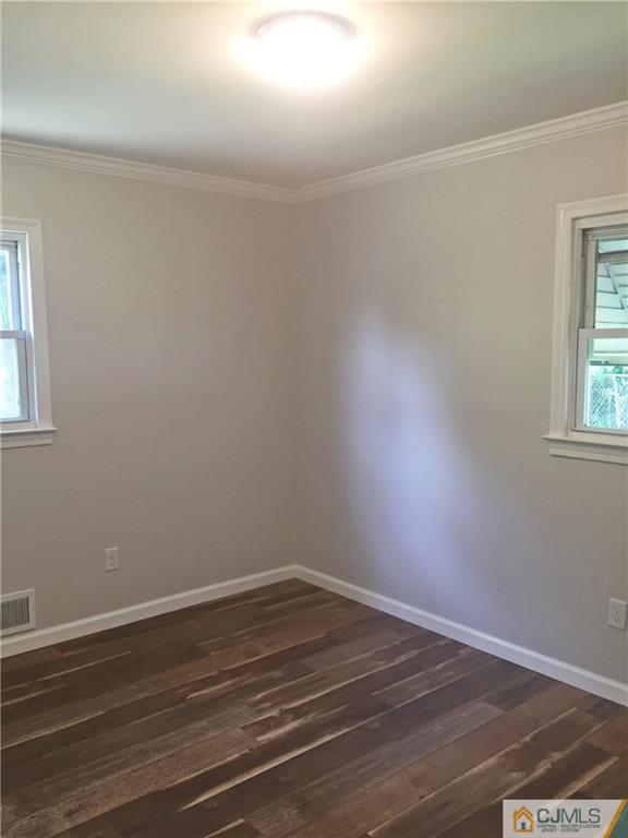 38 Sine Road Edison, NJ 08817 - Photo 8 of 15 a view of a room that has wooden floor and cabinets