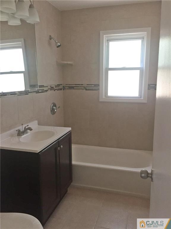 38 Sine Road Edison, NJ 08817 - Photo 9 of 15 a bathroom with a sink and a bathtub