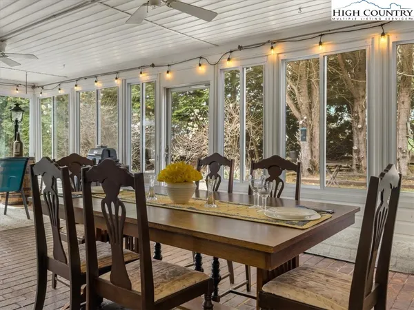 a view of a dining room with furniture window and outside view