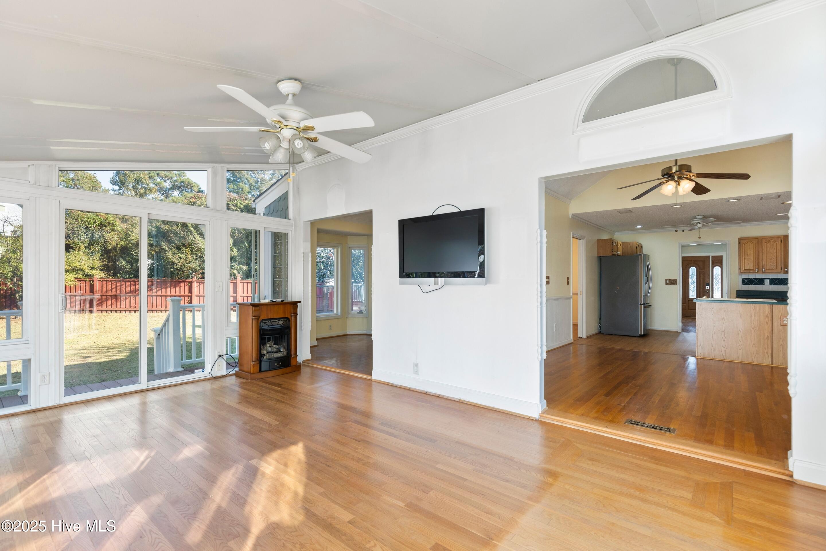1501 Field View Road Wilmington, NC 28411 - Photo 24 of 57 Sunroom with hardwood floors, flooded with natural light.