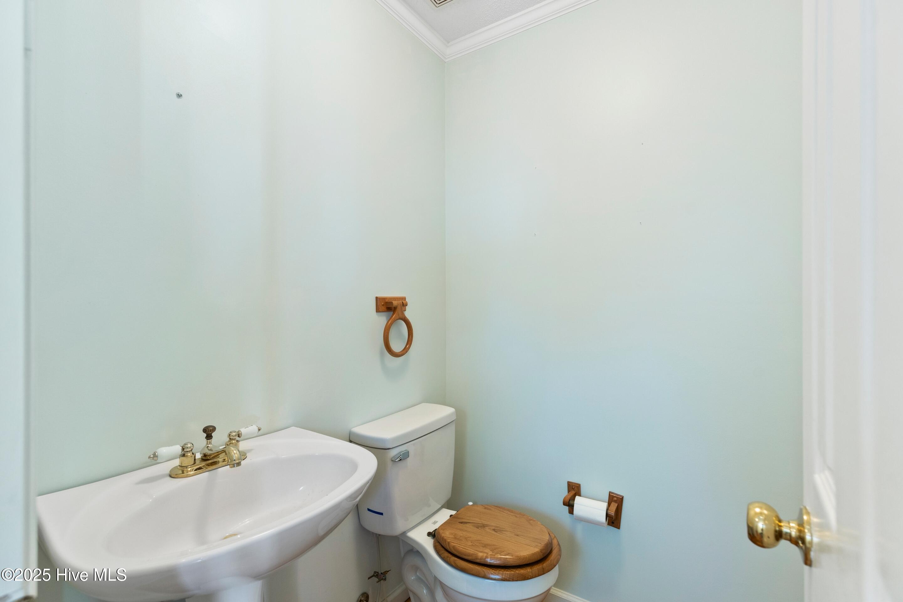 1501 Field View Road Wilmington, NC 28411 - Photo 26 of 57 Half bathroom with hardwood floors.