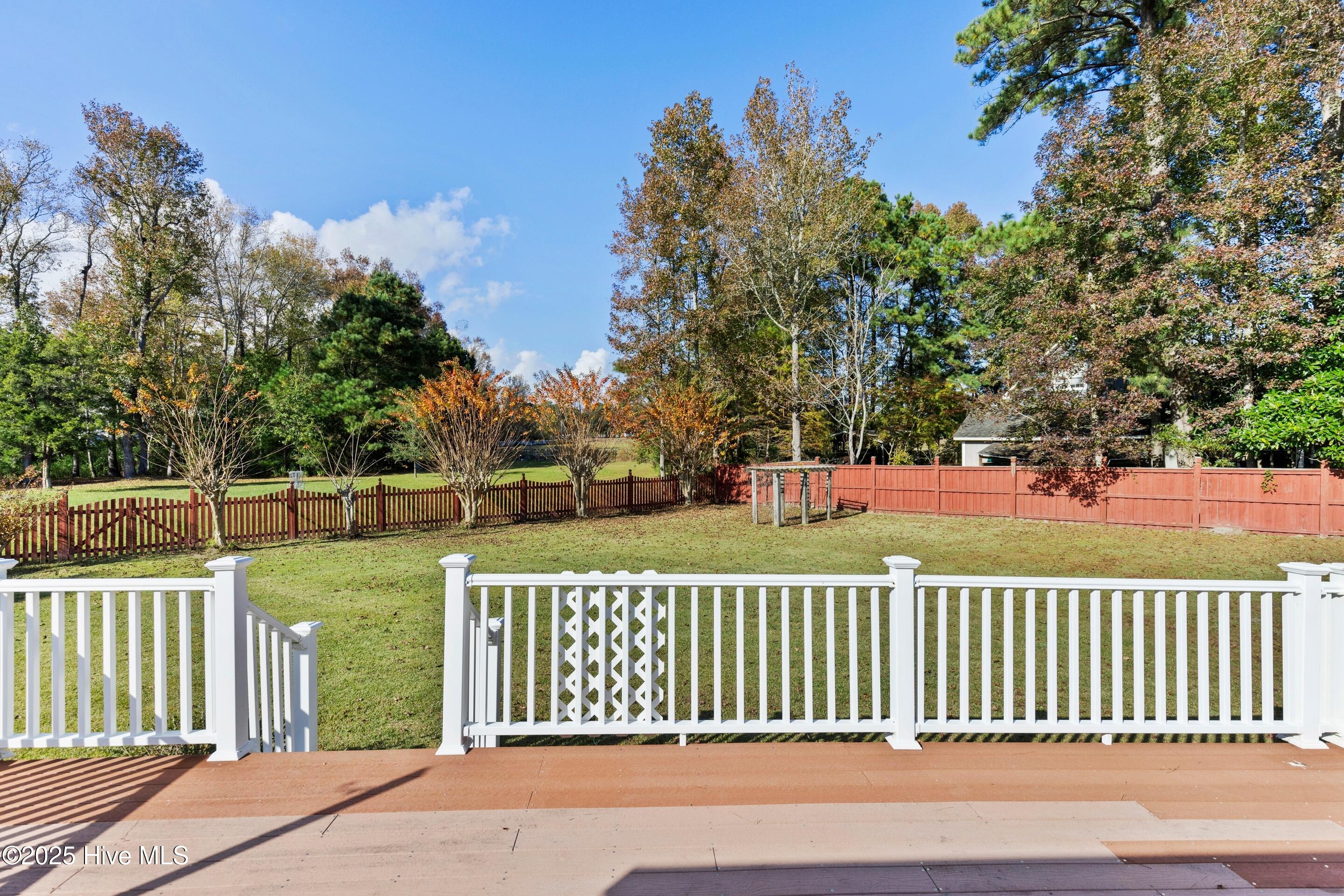 1501 Field View Road Wilmington, NC 28411 - Photo 51 of 57 Lage deck overlooking large backyard, which also overlooks the horse farm across the yards.