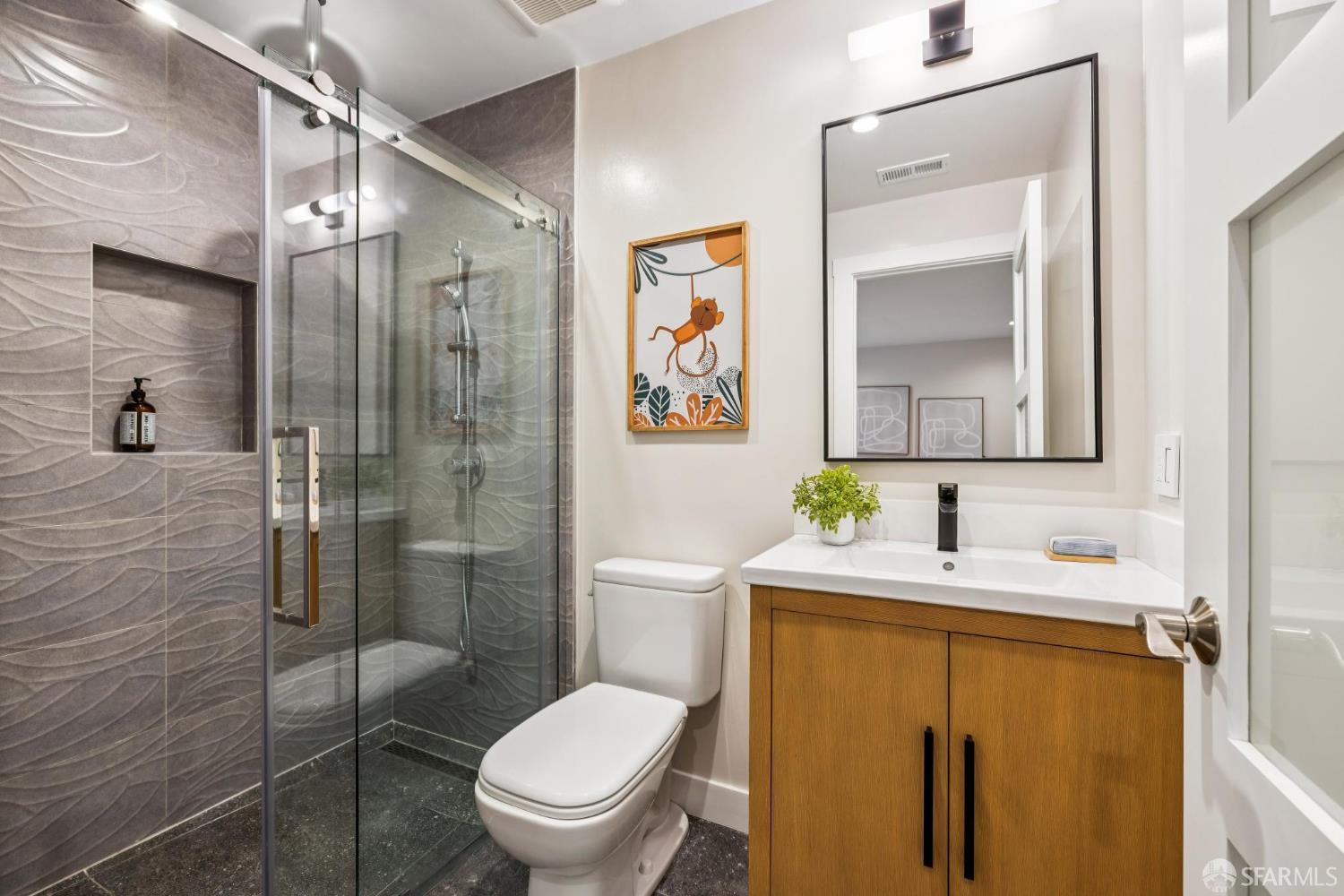 2024 15th Avenue San Francisco, CA 94116 - Photo 58 of 99 a bathroom with a granite countertop toilet sink and shower