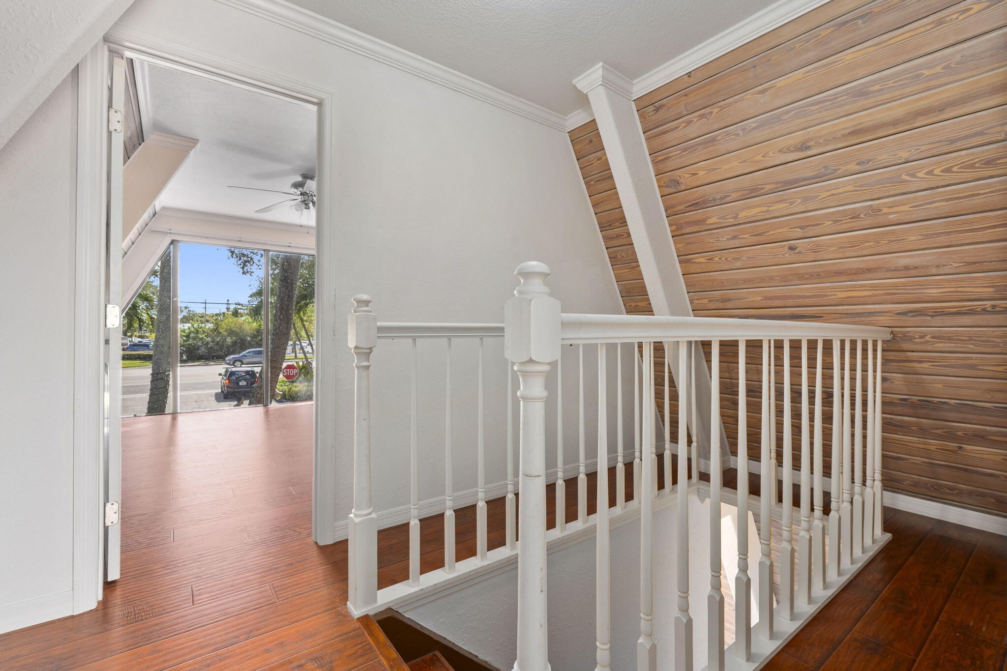 1001 Southeast Monterey Road Stuart, FL 34994 - Photo 13 of 17 a view of staircase with railing and white walls