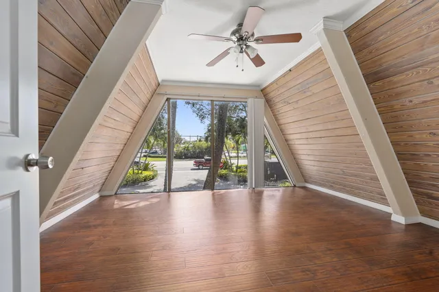 a view of an entryway with wooden floor