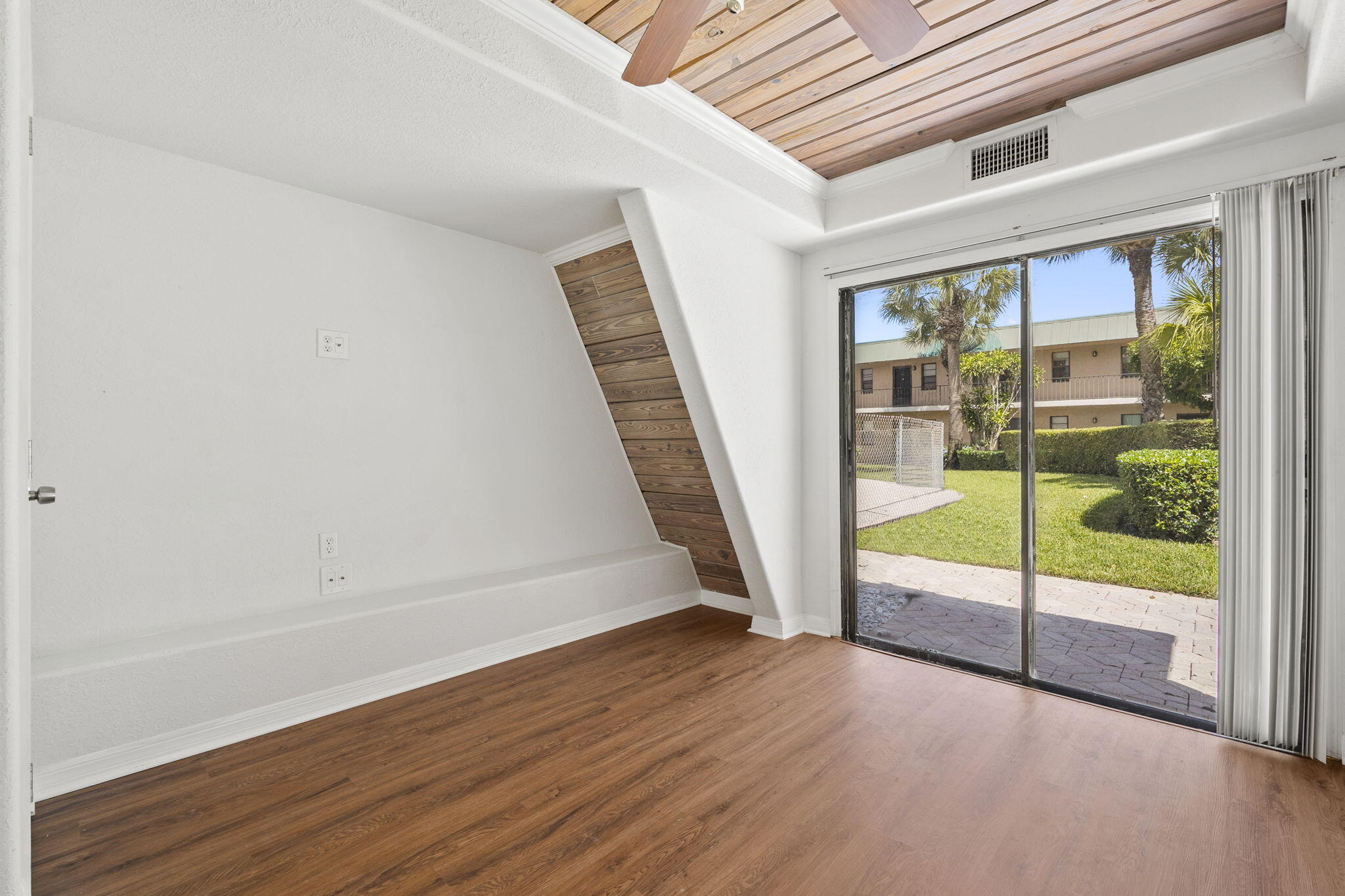 1001 Southeast Monterey Road Stuart, FL 34994 - Photo 8 of 17 a view of an entryway with wooden floor