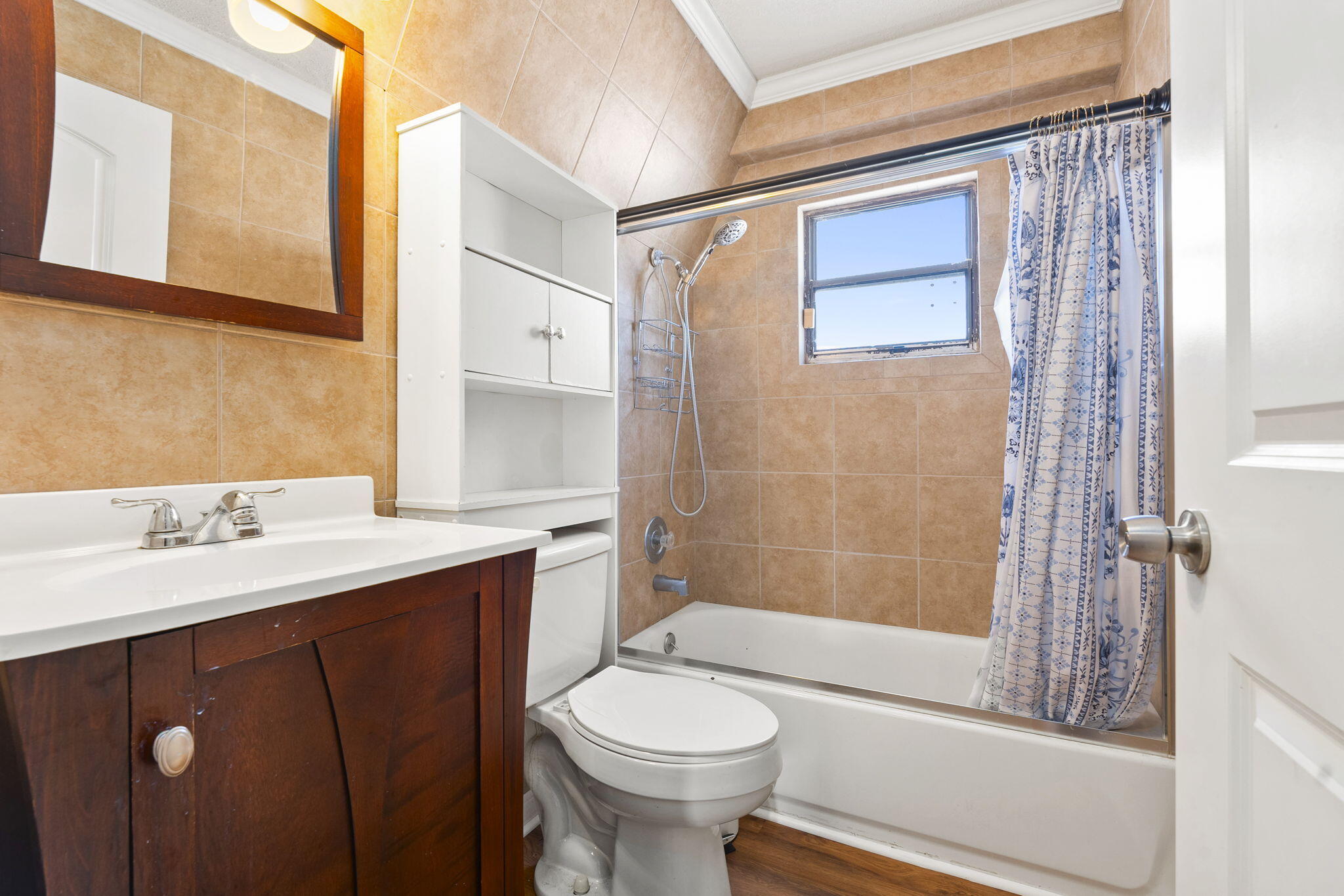 1001 Southeast Monterey Road Stuart, FL 34994 - Photo 10 of 17 a bathroom with a sink a toilet and shower
