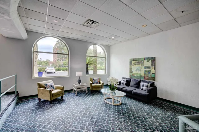 a living room with furniture and a large window