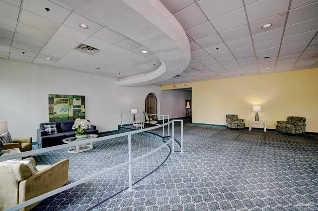 a living room with furniture and a table