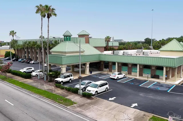 a view of a patio with chairs and a table