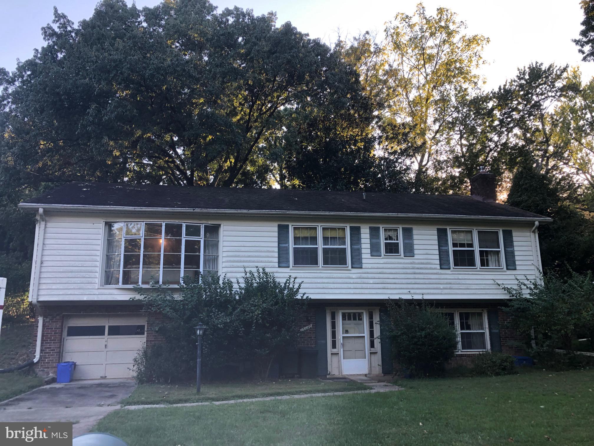 13140 Clifton Road Silver Spring, MD 20904 - Photo 1 of 1 a front view of a house with a garden