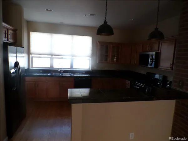a kitchen with a sink and a window