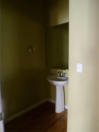 a bathroom with a sink and mirror