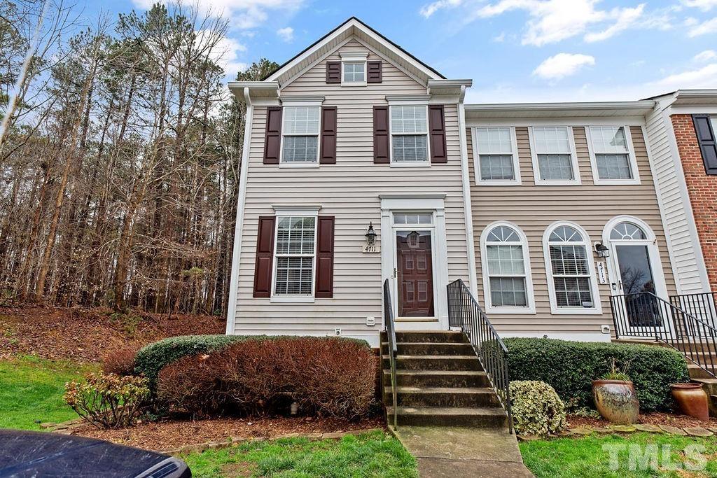 4711 Longhill Lane Raleigh, NC 27612 - Photo 1 of 27 a front view of a house with a yard