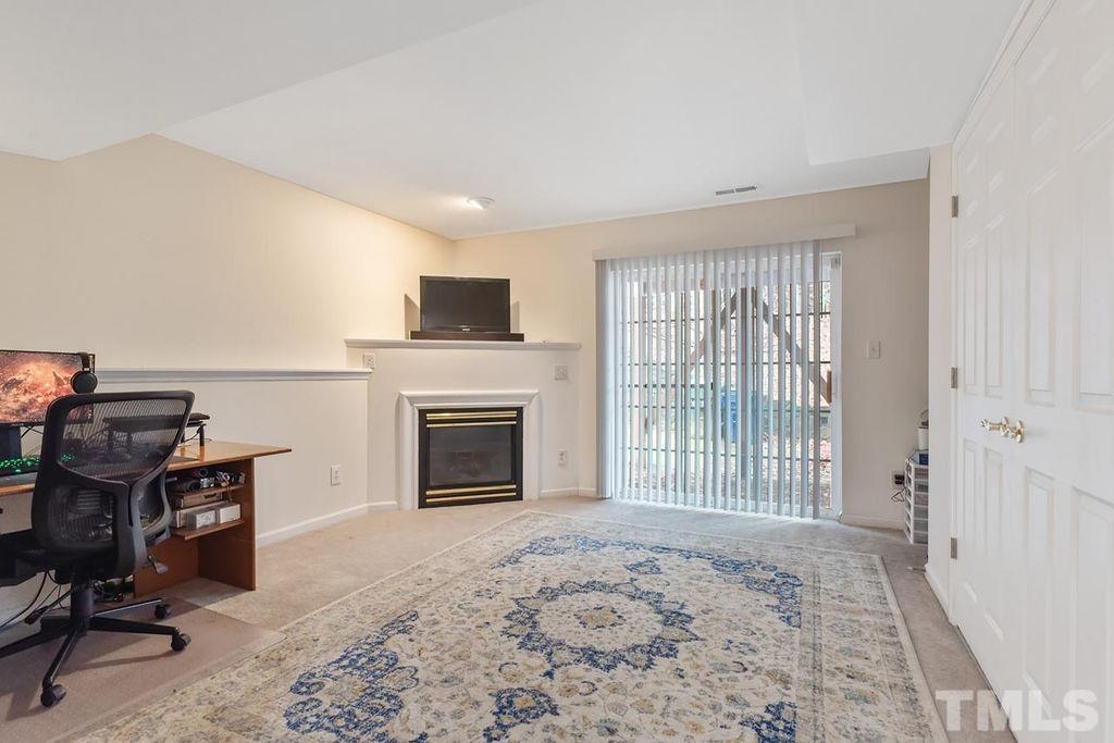 4711 Longhill Lane Raleigh, NC 27612 - Photo 15 of 27 a view of a livingroom with a fireplace