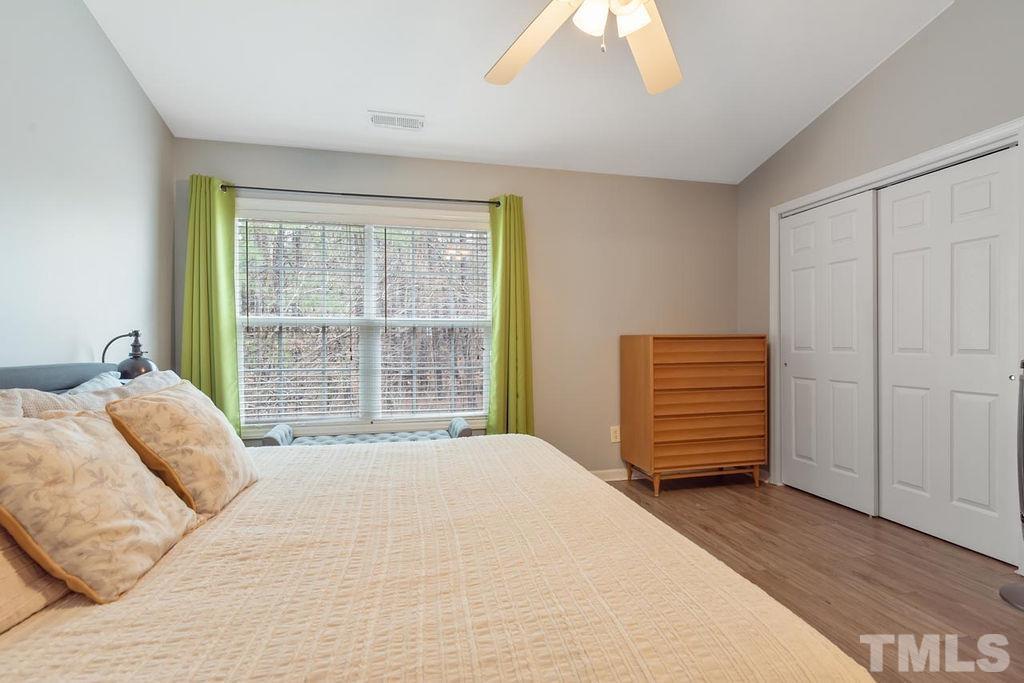 4711 Longhill Lane Raleigh, NC 27612 - Photo 26 of 27 a bedroom with a bed and a window