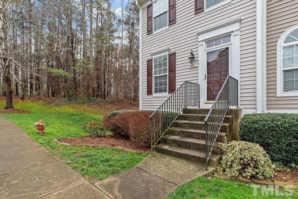 4711 Longhill Lane Raleigh, NC 27612 - Photo 3 of 27 a view of a house with backyard and a garden