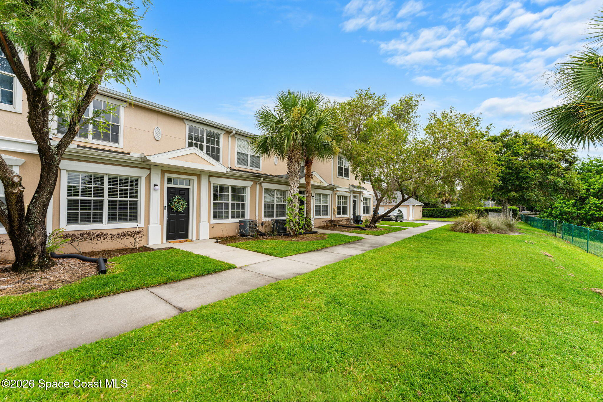 110 Turpial Way, Unit 106 Melbourne, FL 32901 - Photo 3 of 50 a view of a house with a backyard