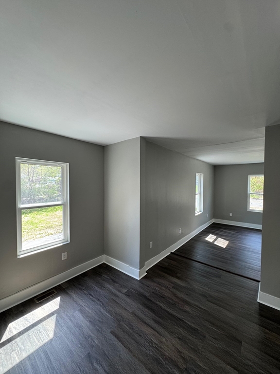 32 Main Street Monson, MA 01057 - Photo 11 of 42 a view of an empty room with window and wooden floor