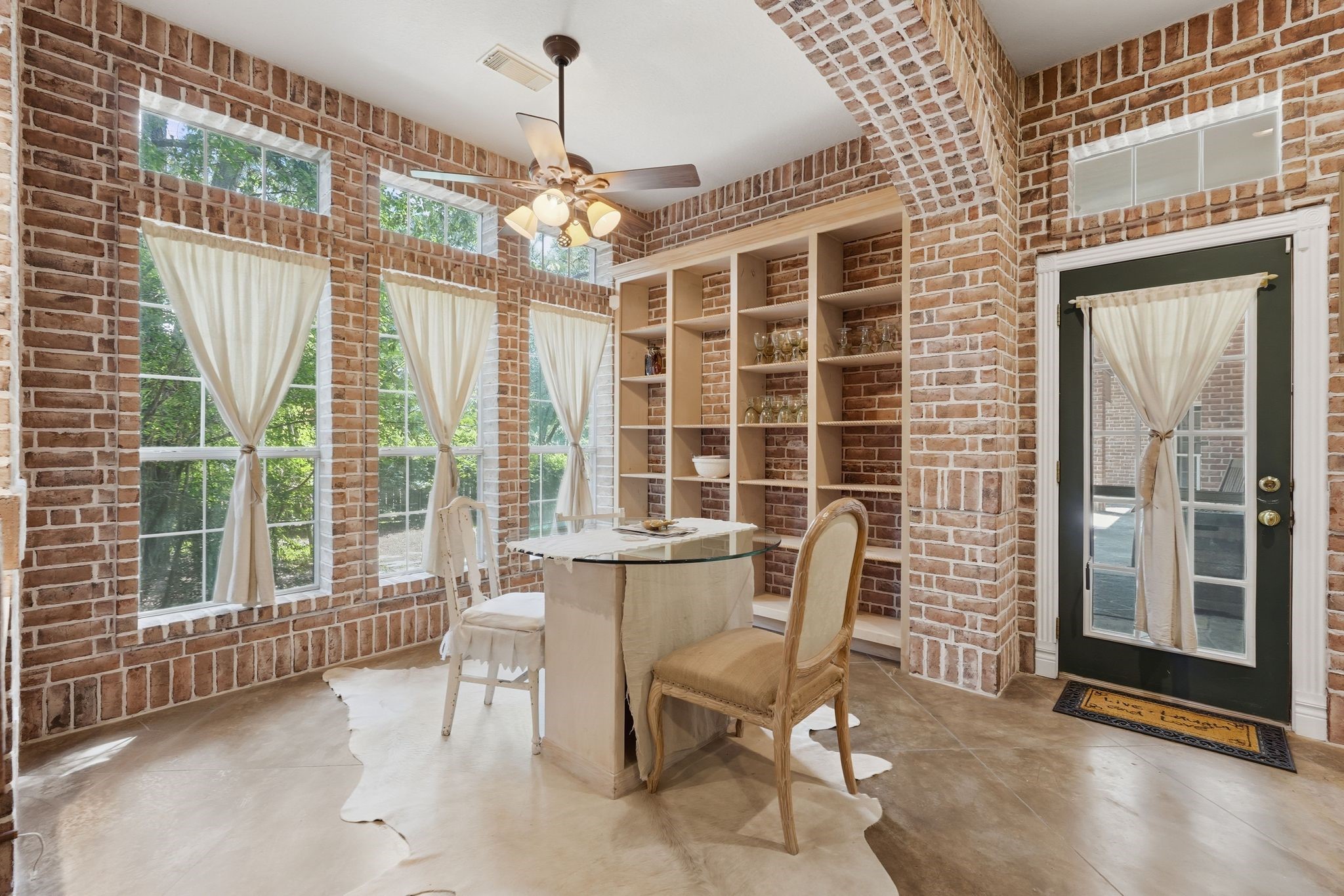 25014 Northampton Terrace Drive Spring, TX 77389 - Photo 12 of 41 Another look at the breakfast room complete with custom shelving for your favorite dinnerware, glassware or knick-knacks. The side door opens to the covered back patio