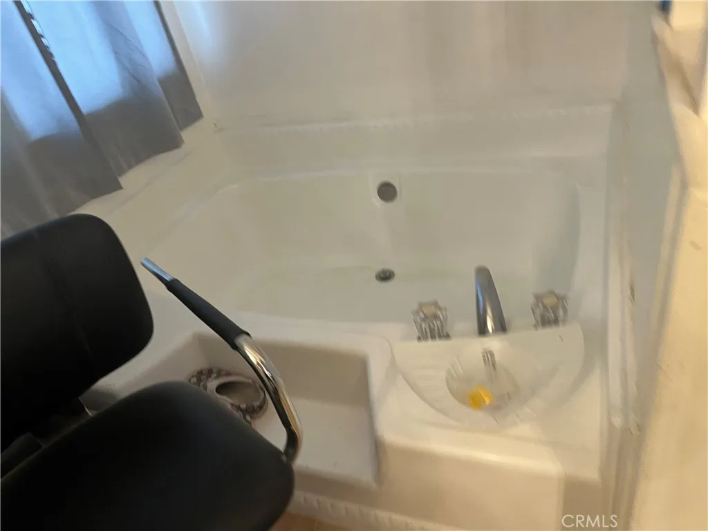 3700 Buchanan Street, Unit 98 Riverside, CA 92503 - Photo 17 of 18 a bathroom with a sink and a tub