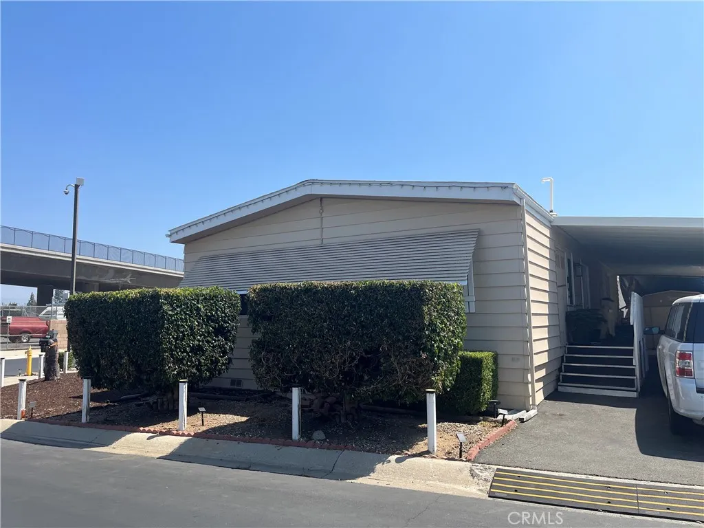 3700 Buchanan Street, Unit 98 Riverside, CA 92503 - Photo 5 of 18 a building with trees in front of it