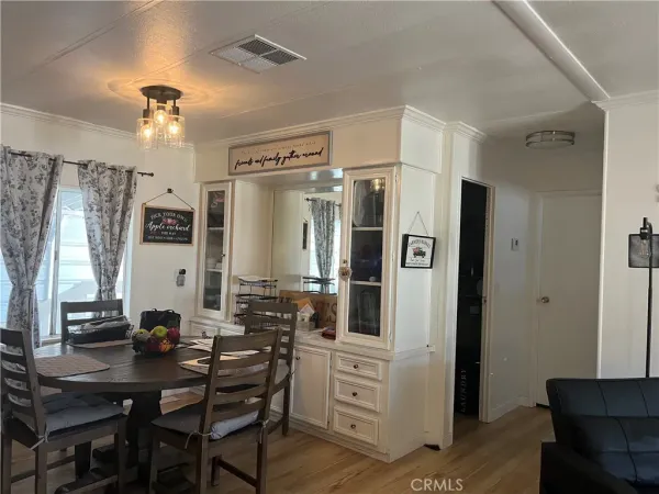 a very nice looking dining room with window