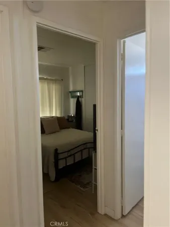 a bedroom with a bed and a mirror